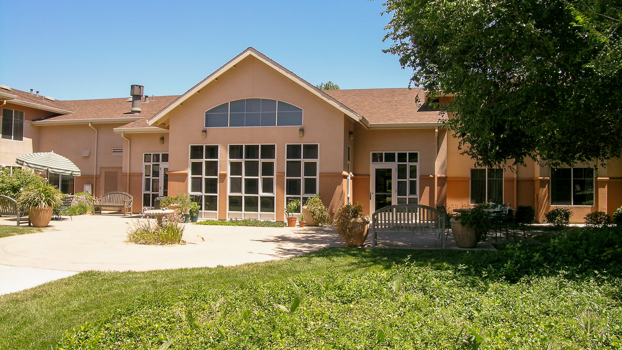 Exterior view of community room at Columbia Park Manor in Pittsburg, CA