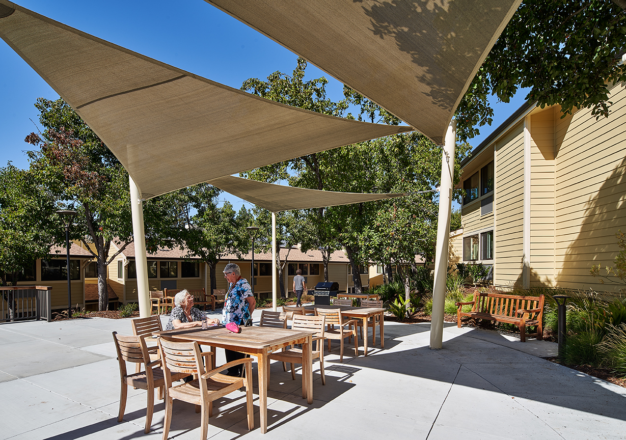 Shaded patio seating at Casa Montego in Walnut Creek, CA.