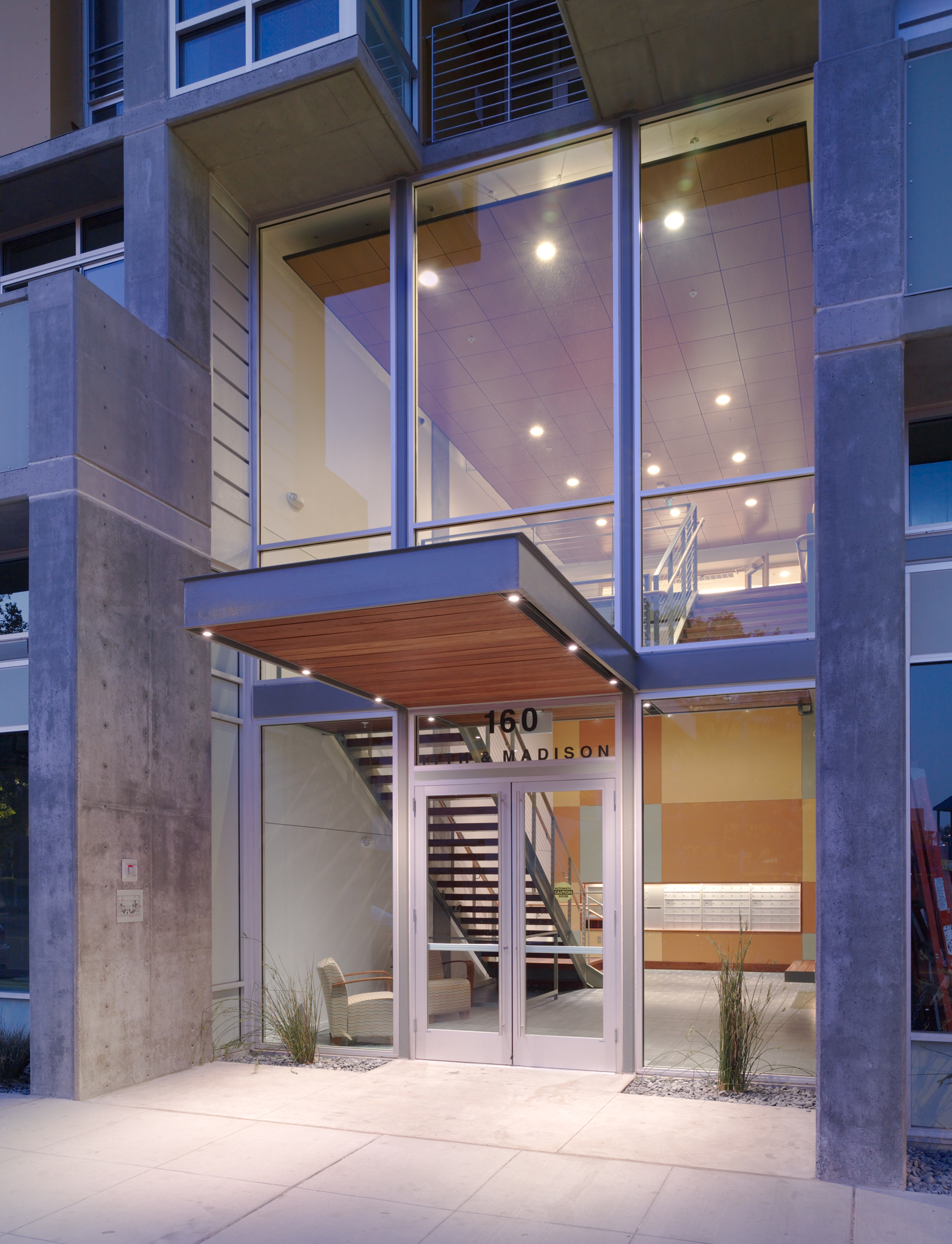Main entrance at dusk, Madison Apartments at 14th Street in Oakland, CA.
