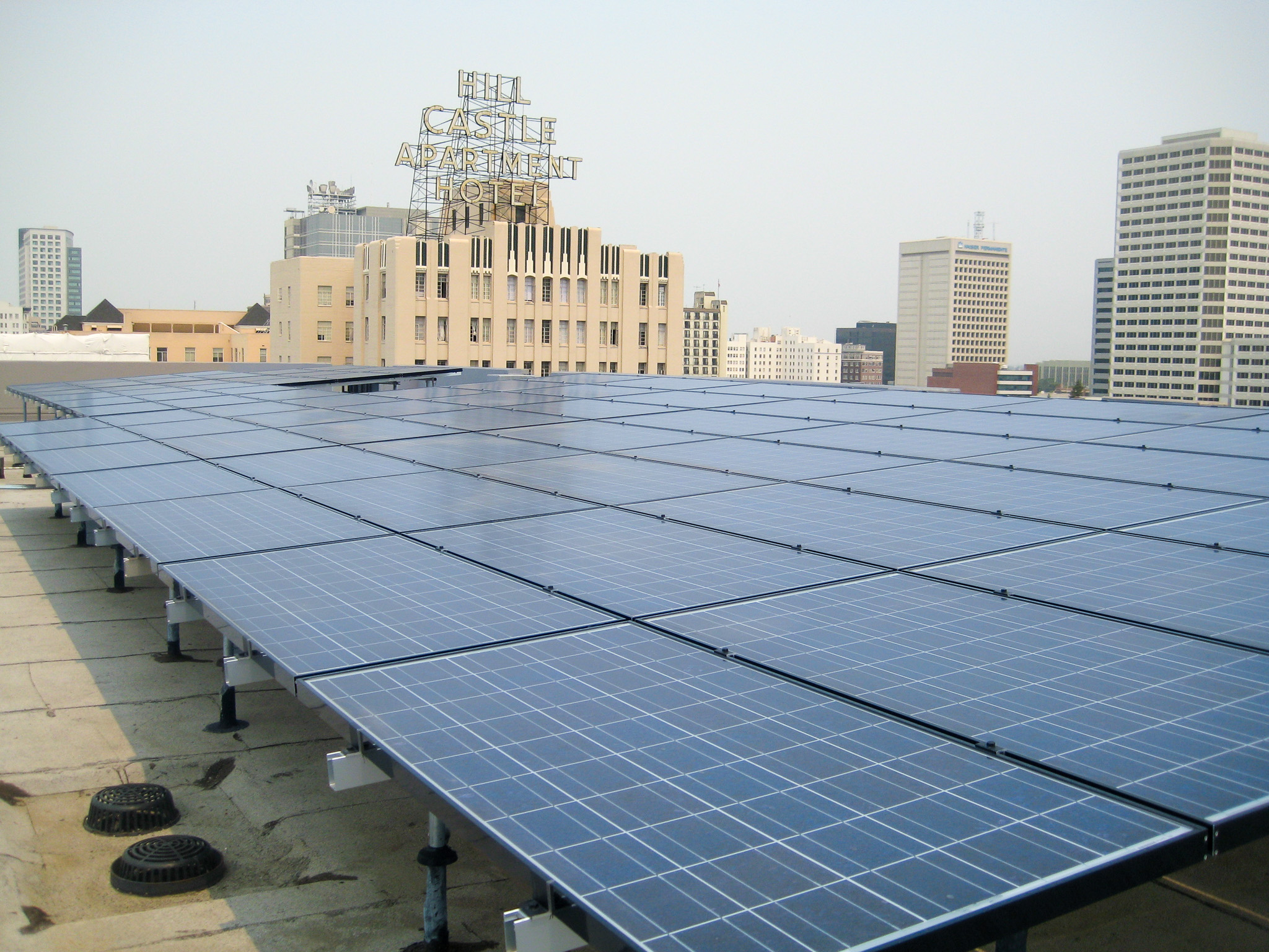 Solar panels on the roof of Madison Apartments at 14th Street in Oakland, CA.