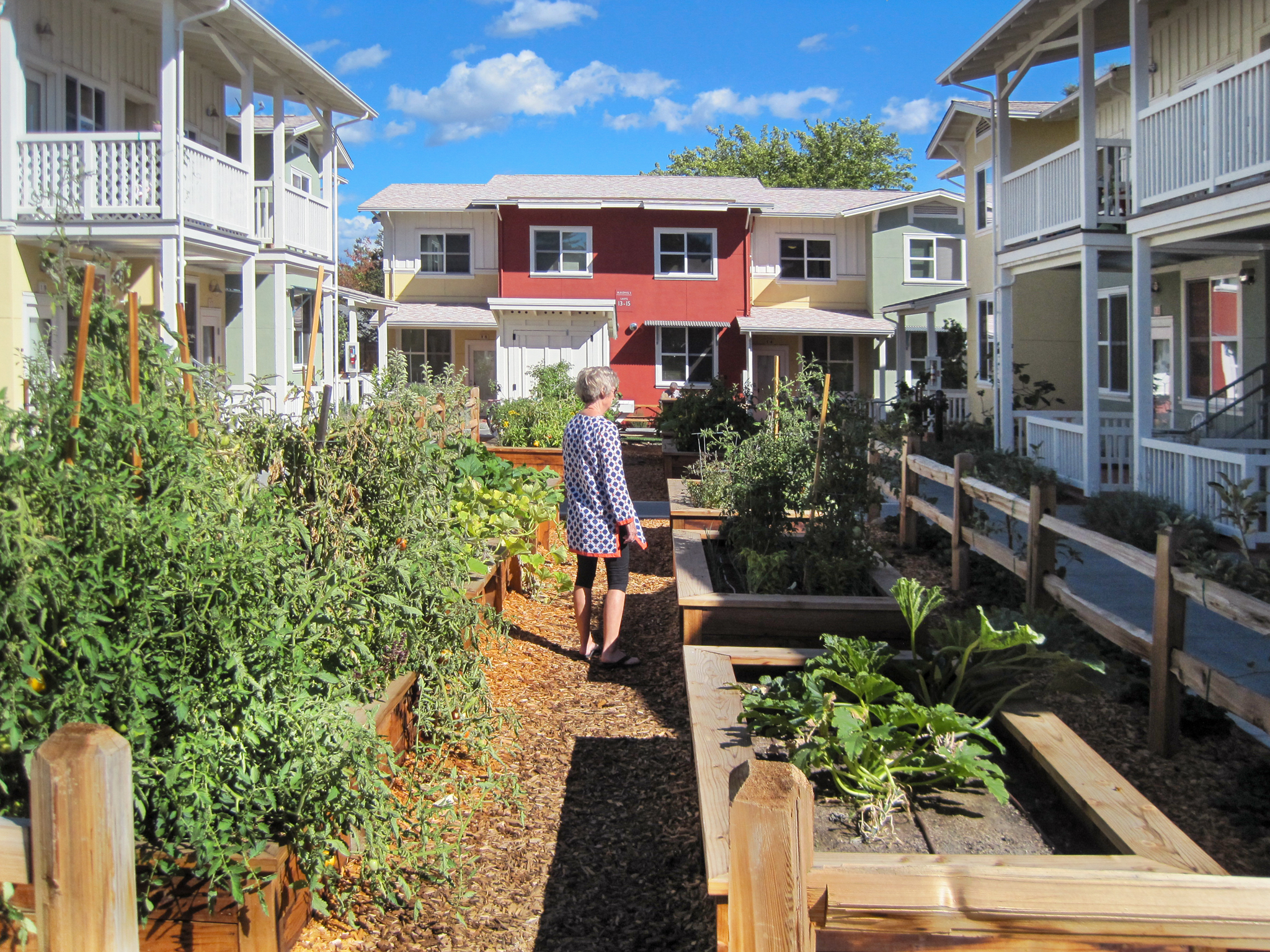 Resident enjoys the community garden at Valley Oak Homes in Petaluma, CA.