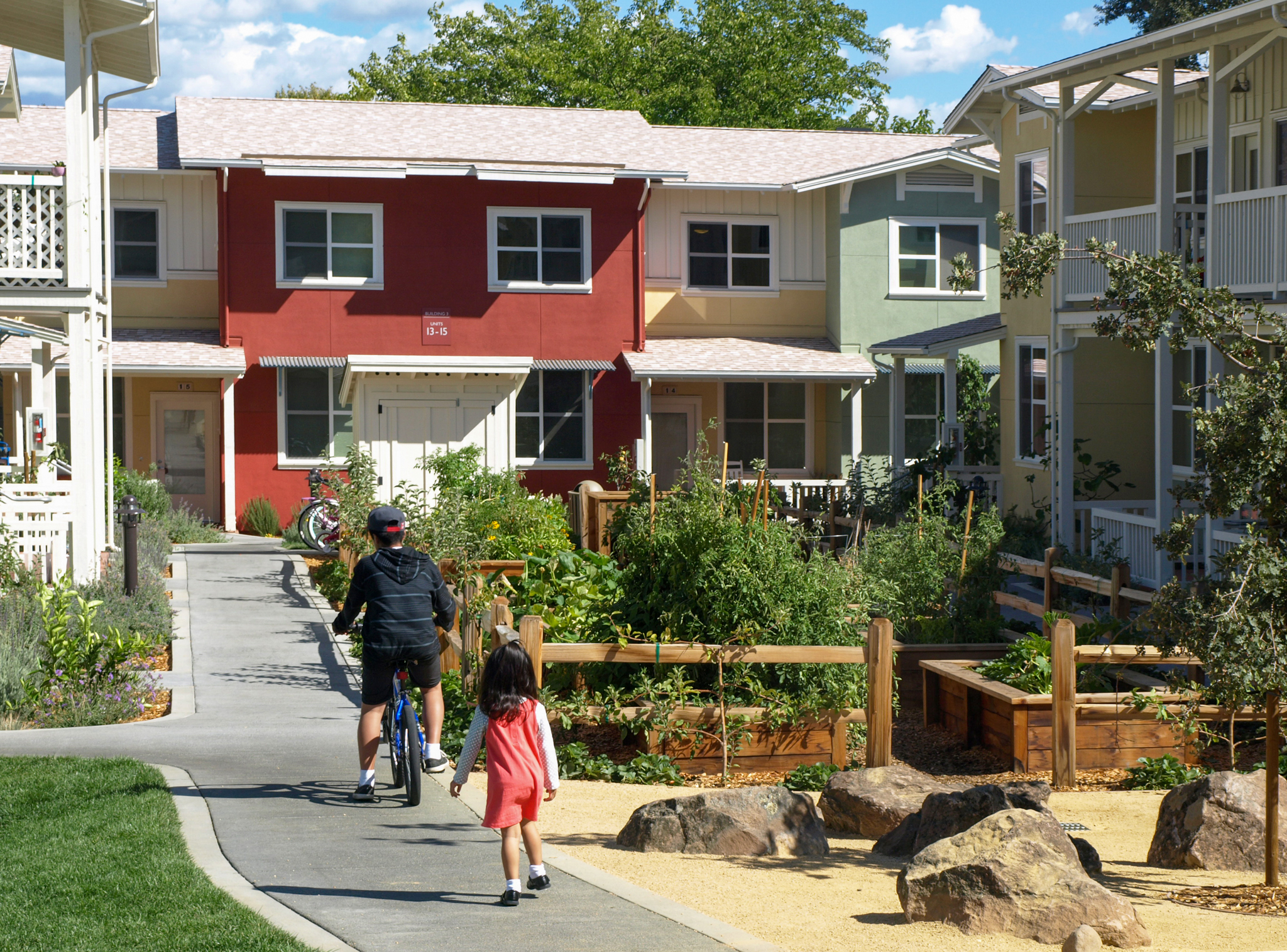 Children play in the courtyard path at Valley Oak Homes in Petaluma, CA