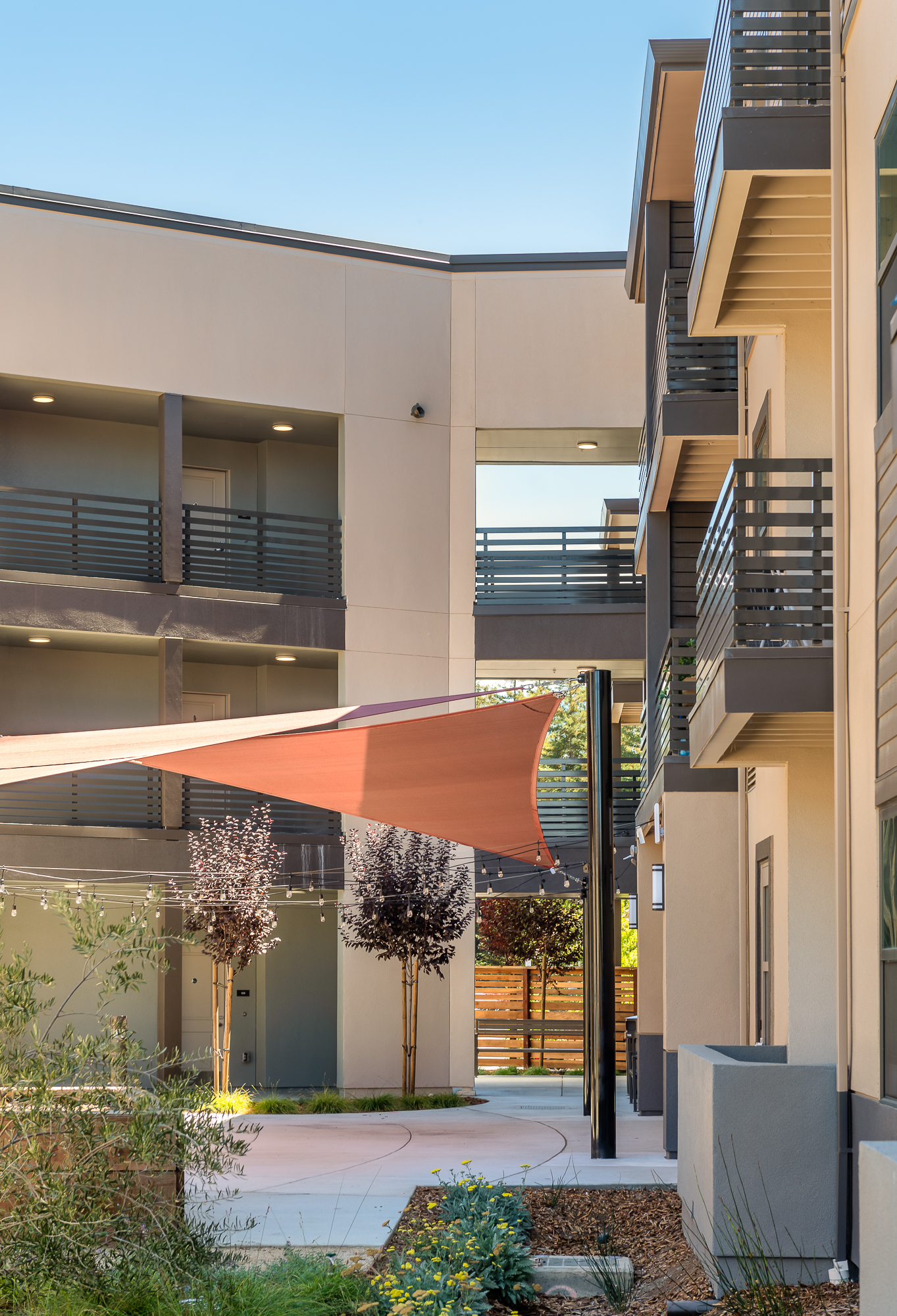 Courtyard view of the balconies at of Manzanita Family Apartments in Napa