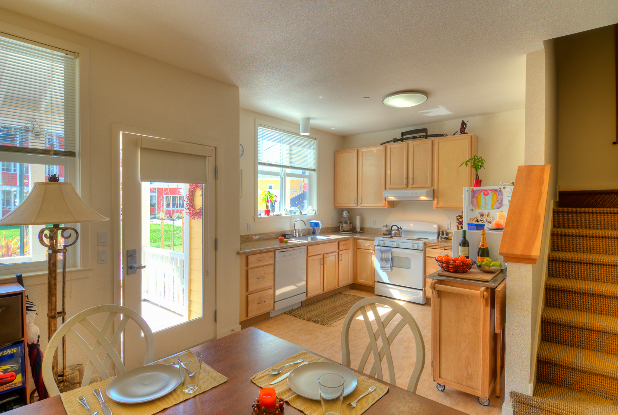 In-unit kitchen and dining area at Petaluma Avenue Homes in Petaluma, CA.