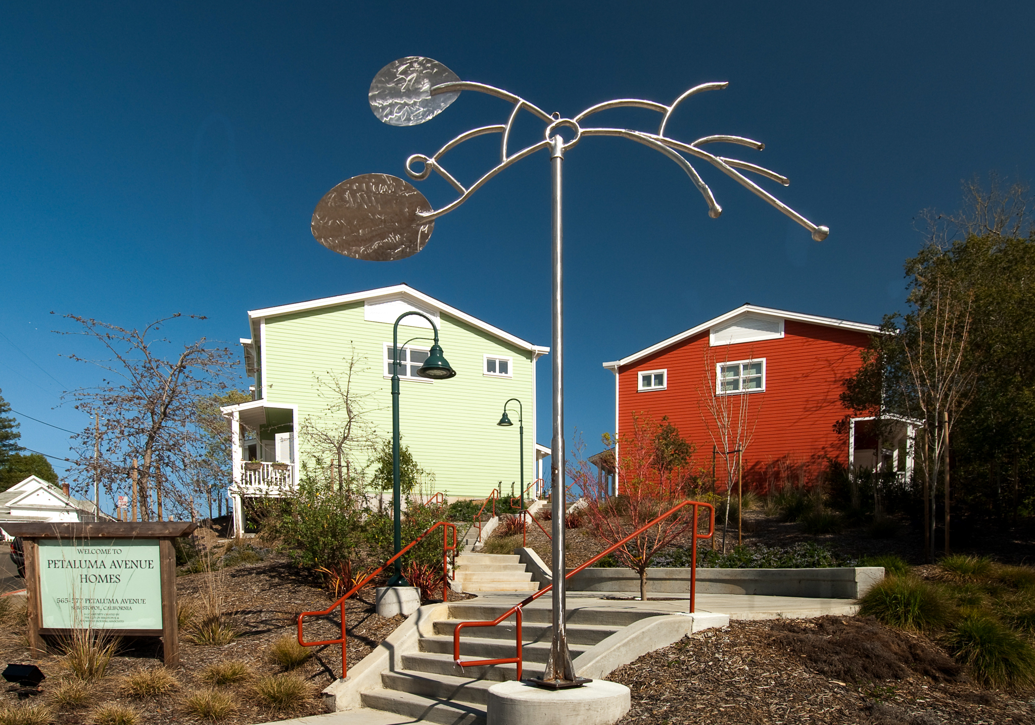 Outdoor metal art sculpture off the path at Petaluma Avenue Homes in Petaluma, CA.