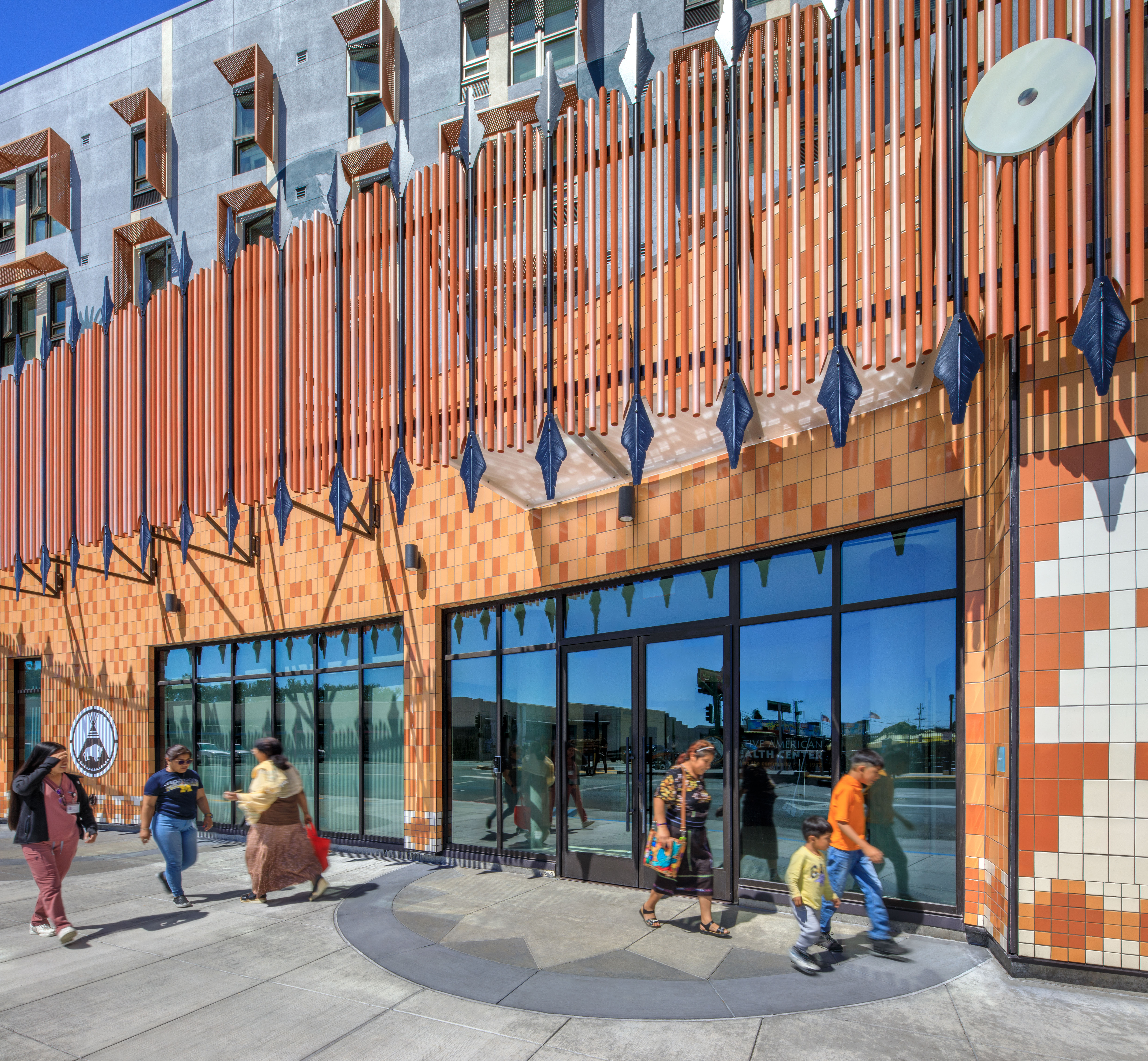 Main entrance detail at Flicker Bird Homes and Native American Health Center in Oakland, CA