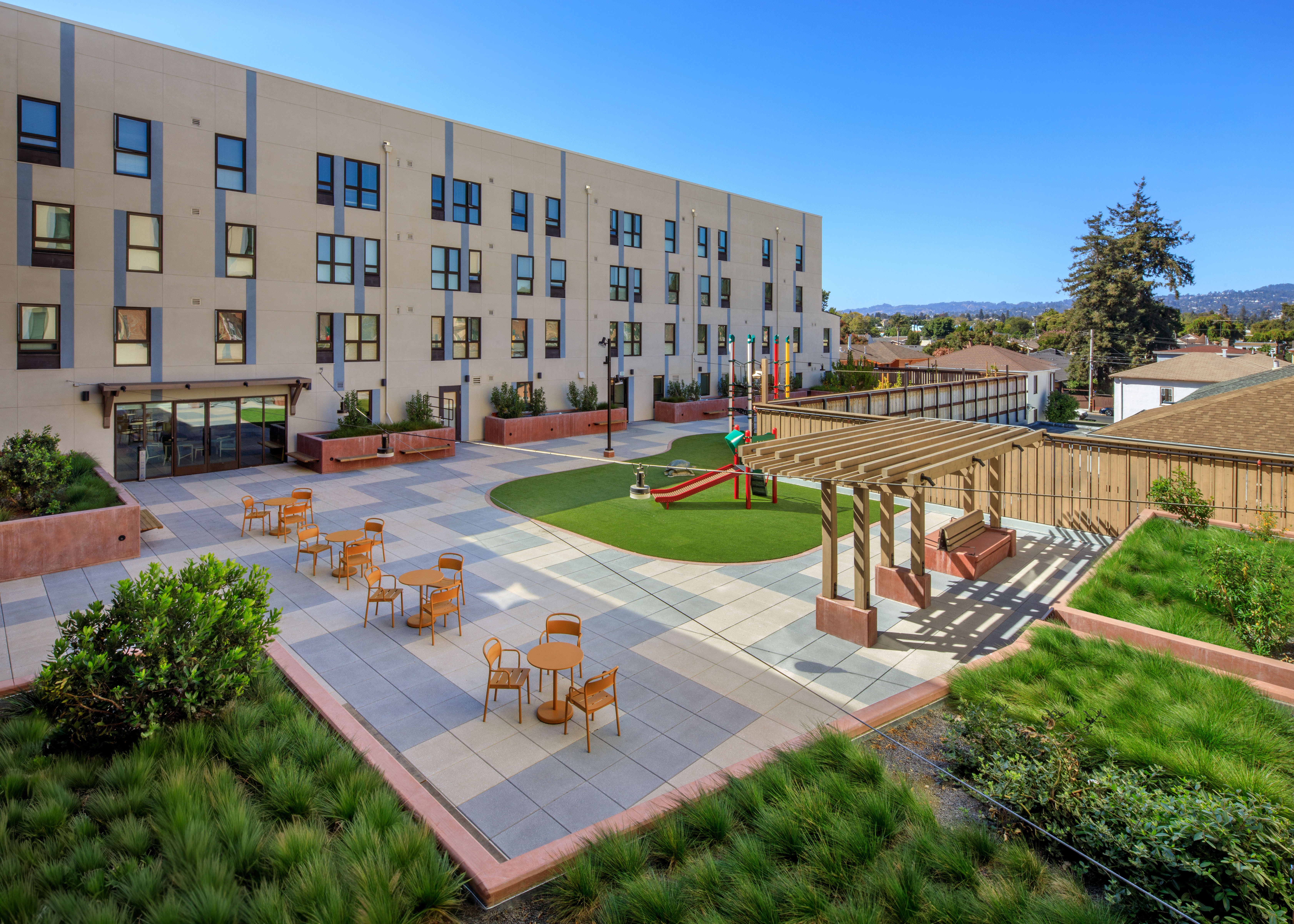 Outdoor space and courtyard at Flicker Bird Homes and Native American Health Center in Oakland, CA